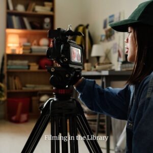 Photographer and camera recording in a library